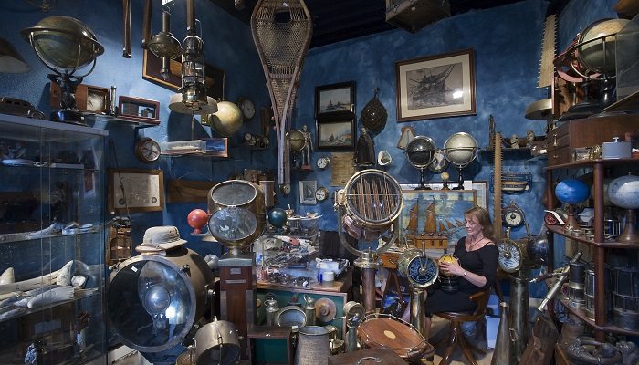 Vintage travel gear seller at the marche Dauphine, Paris